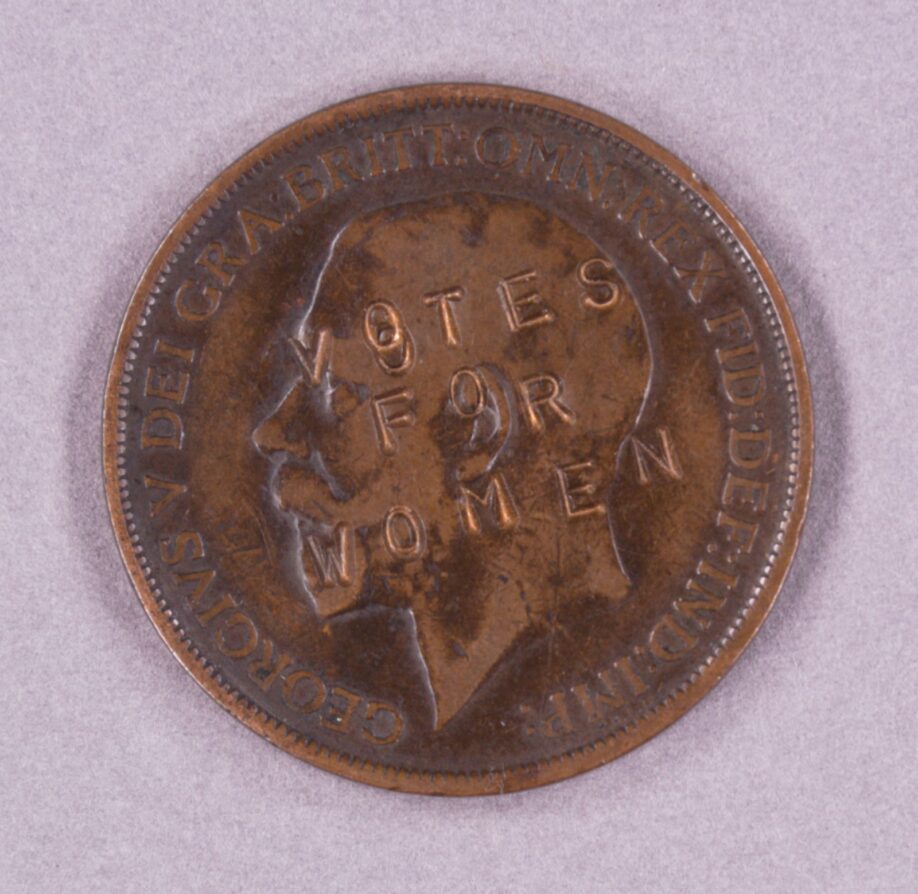 A penny with 'Votes For Women' stamped in capitals on the obverse, which bears the head of King George V