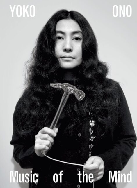 Book cover showing a black and white photo of Yoko Ono holding a glass hammer and looking at the camera. Text reads 'Yoko Ono - Music of the Mind'