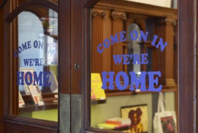 The entrance doors at GWL, bearing the words 'Come on in, we're home'