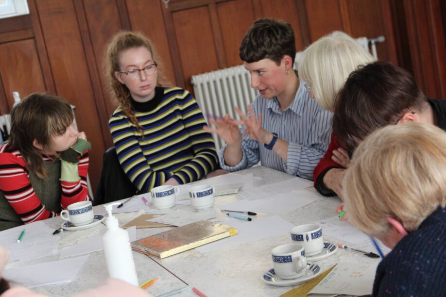 Workshop attendees engrossed in discussion in our community room