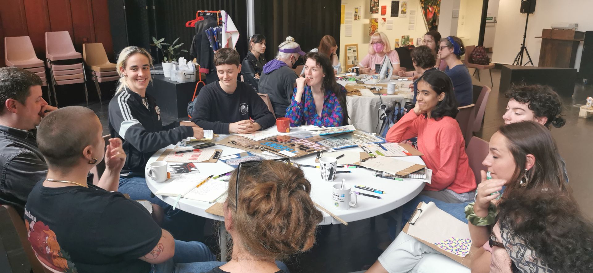 Workshop attendees in discussion at a workshop about how to protest