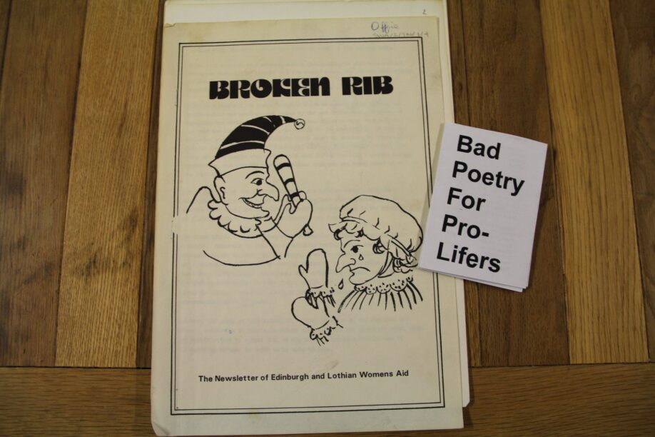 the newsletter "Broken Rib" and a little zine called "bad poetry for pro-lifers" displayed on a table