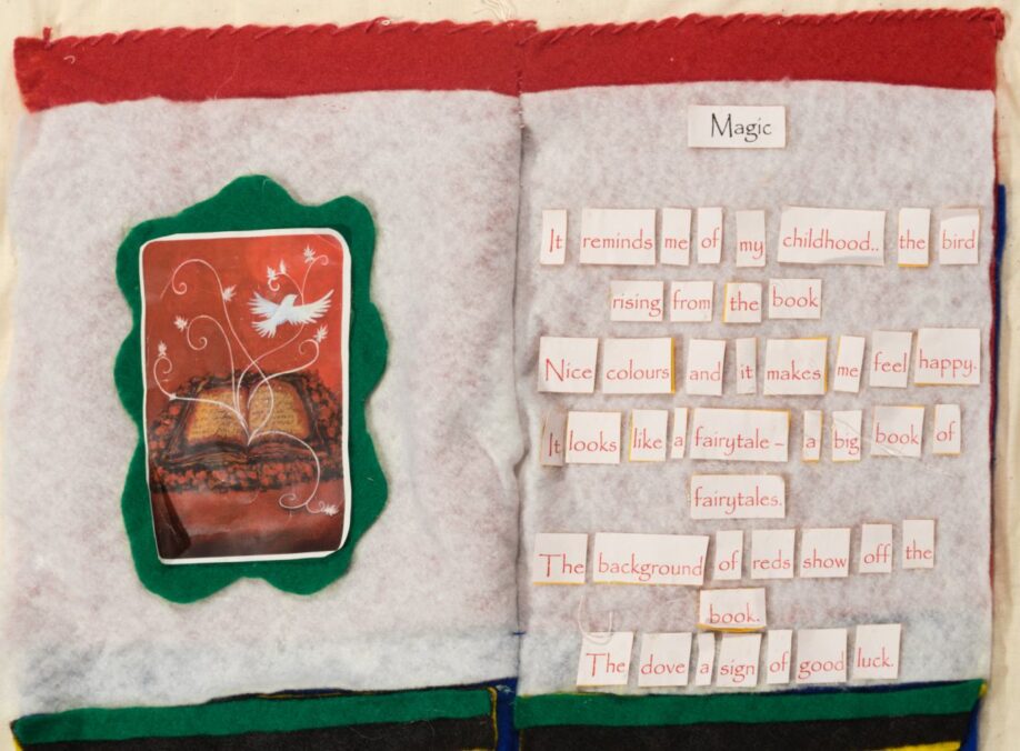 A book made of felt lies open. On the right-hand pages is a poem called 'Magic'. On the left-hand page is a graphic of a bird flying out of the pages of an open book.