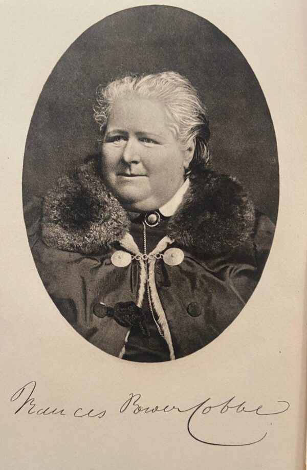 A black and white photo of Frances Power Cobbe aged 68. Signature underneath. 