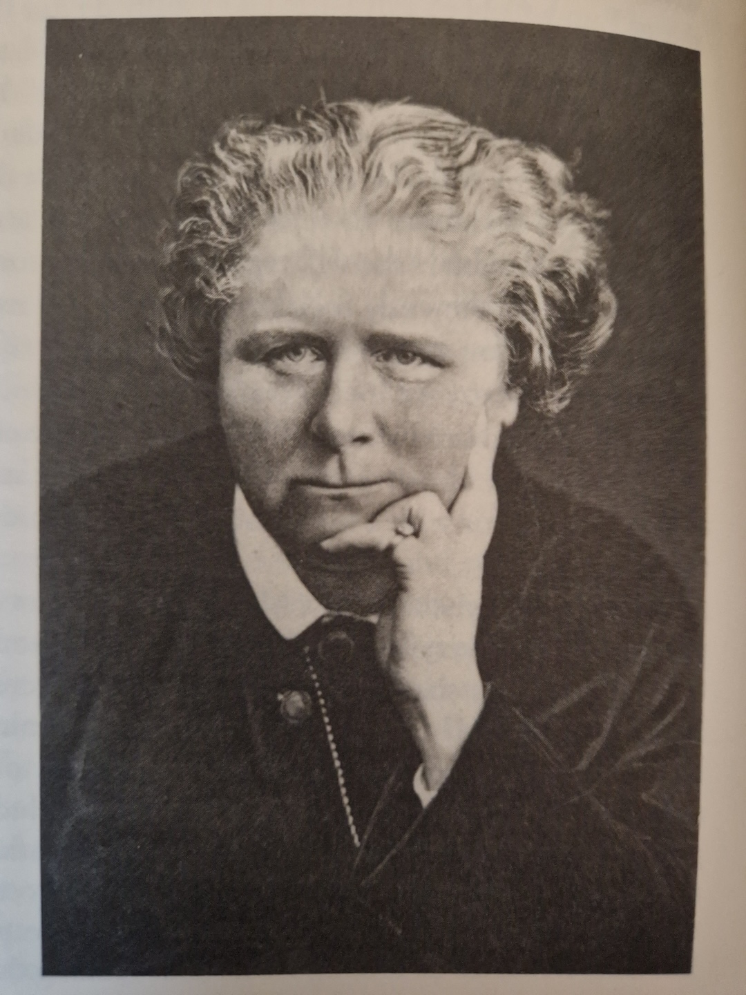 Black and white photograph of Frances Power Cobbe. Resting her chin on her hand.