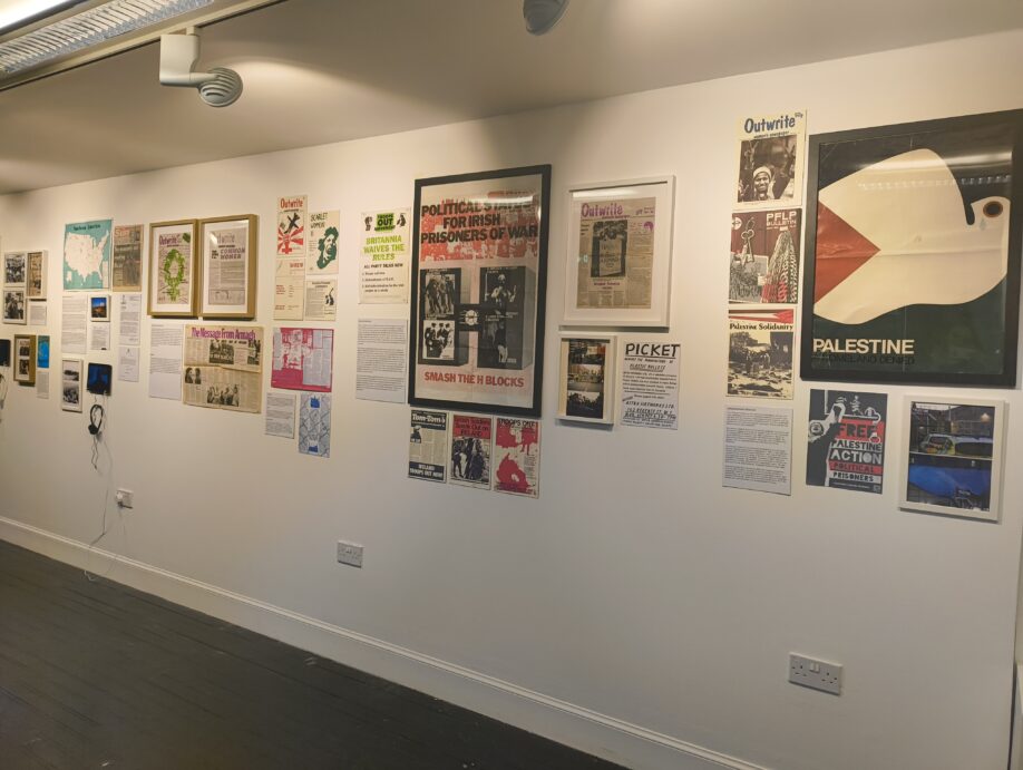 A variety of posters, pamphlets, newspapers, and photos from across the downstairs section of the exhibition.